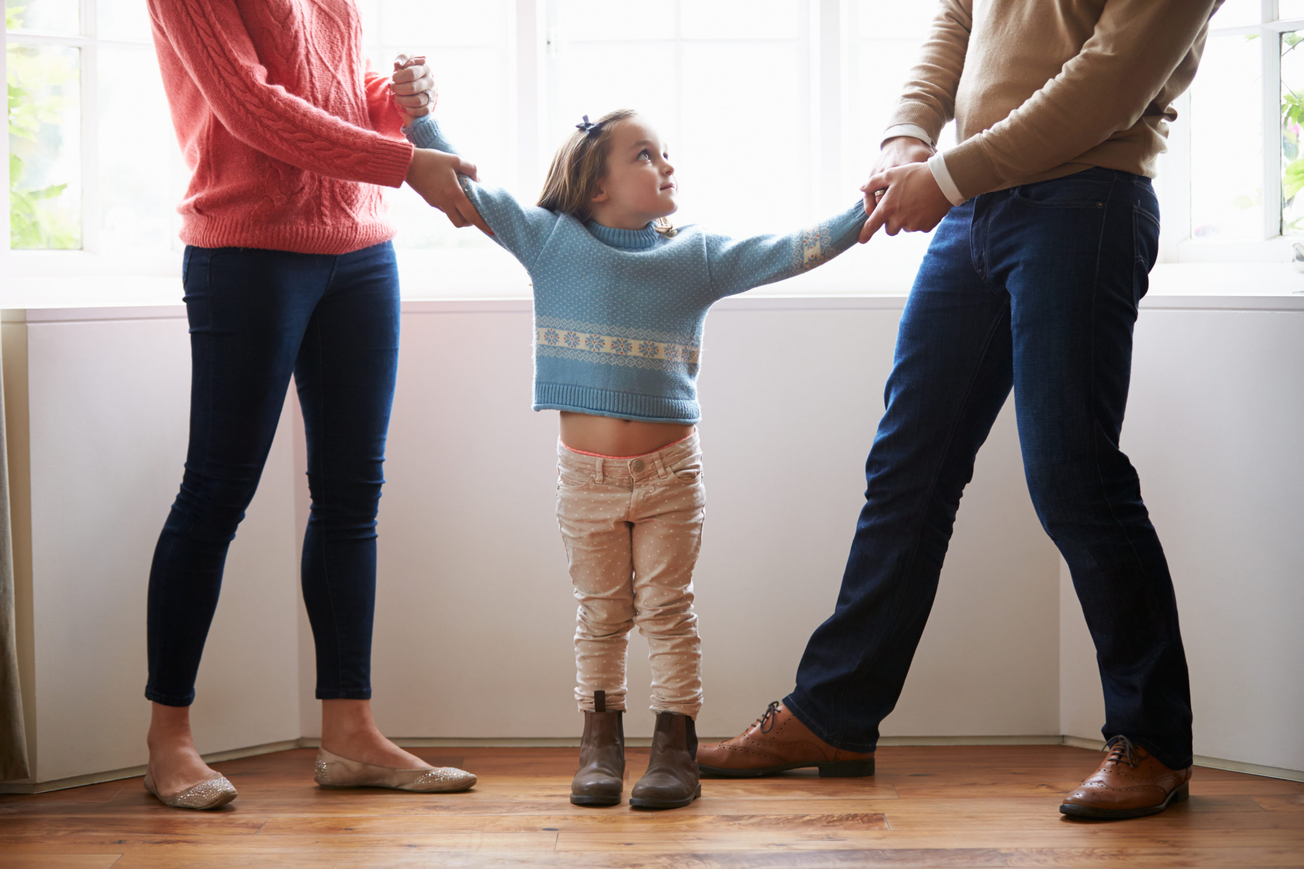 Daughter stuck in the middle of her parents